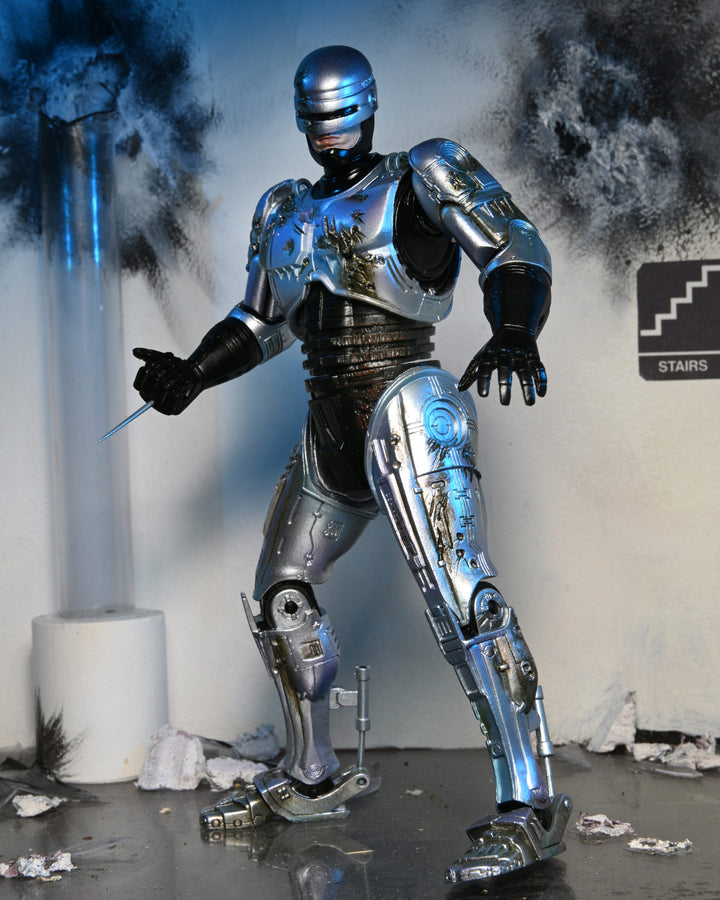 NECA Robocop 7” Scale Ultimate Battle Damaged RoboCop with Chair Action Figure