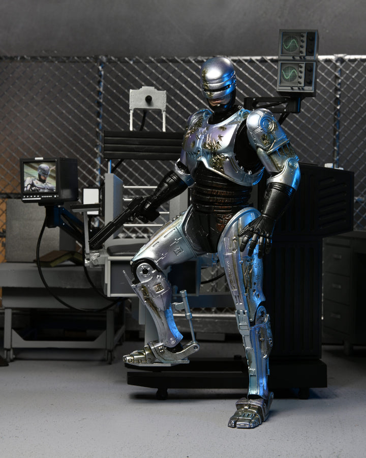 NECA Robocop 7” Scale Ultimate Battle Damaged RoboCop with Chair Action Figure