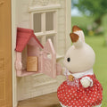 Sylvanian Families Red Roof Cosy Cottage Starter Home for Ages 3 & Up, in display