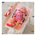 BABY born Changing Table with changing mat and storage shelf in use