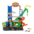 Hot Wheels City Ultimate T-Rex Garage Playset with 2 die-cast cars side angle