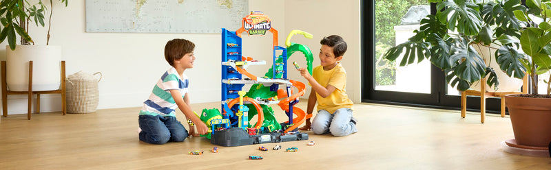 Hot Wheels City Ultimate T-Rex Garage Playset with 2 die-cast cars close up detail