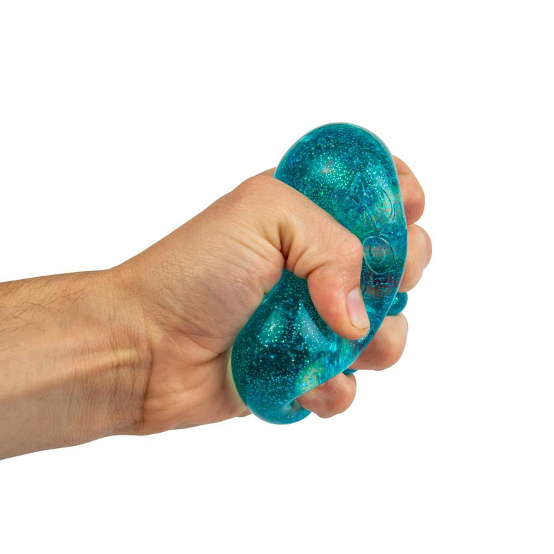 NeeDoh Nice Cube Glitter & Glow Fidget Toy in hand view